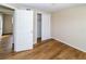 Spacious bedroom with wood-look floors and a closet at 4215 Pecos Dr, New Port Richey, FL 34653