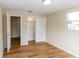 Spacious bedroom with wood-look floors and ample closet space at 4215 Pecos Dr, New Port Richey, FL 34653