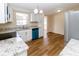 Modern kitchen with granite countertops and teal dishwasher at 4215 Pecos Dr, New Port Richey, FL 34653