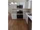 Updated kitchen with stainless steel appliances and granite countertops at 4215 Pecos Dr, New Port Richey, FL 34653