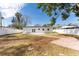 Renovated home with spacious backyard, patio, and mature trees at 4401 Shore Acres Ne Blvd, St Petersburg, FL 33703