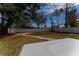 Spacious backyard with large tree and fence at 4401 Shore Acres Ne Blvd, St Petersburg, FL 33703