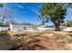 Large backyard with expansive lawn and mature shade tree at 4401 Shore Acres Ne Blvd, St Petersburg, FL 33703