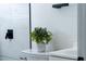 White vase with greenery adds a pop of color at 4401 Shore Acres Ne Blvd, St Petersburg, FL 33703