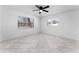 Bright bedroom with large windows and tile flooring at 4401 Shore Acres Ne Blvd, St Petersburg, FL 33703
