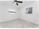 Bright bedroom with tile floors and ceiling fan at 4401 Shore Acres Ne Blvd, St Petersburg, FL 33703