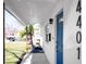 Inviting entryway with a modern blue door and walkway at 4401 Shore Acres Ne Blvd, St Petersburg, FL 33703