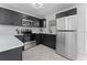 Modern kitchen with stainless steel appliances and white countertop at 4401 Shore Acres Ne Blvd, St Petersburg, FL 33703