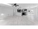 Bright living room with tile floors and modern ceiling fan at 4401 Shore Acres Ne Blvd, St Petersburg, FL 33703