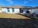 Home features a spacious backyard with patio and seating area at 2022 Peaceful Palm St, Ruskin, FL 33570