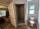 Bathroom featuring a shower stall, tile flooring, and toilet at 2022 Peaceful Palm St, Ruskin, FL 33570