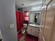 Simple bathroom with a shower/tub combo and white vanity at 2022 Peaceful Palm St, Ruskin, FL 33570