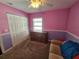 Bedroom with a dresser and a double door closet, and a ceiling fan at 2022 Peaceful Palm St, Ruskin, FL 33570