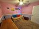 Bedroom with a beige couch and ceiling fan at 2022 Peaceful Palm St, Ruskin, FL 33570