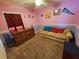 Bedroom with a beige couch and ceiling fan at 2022 Peaceful Palm St, Ruskin, FL 33570