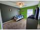 Bedroom featuring grey and green walls, a ceiling fan, carpet flooring, and window at 2022 Peaceful Palm St, Ruskin, FL 33570