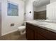 Bathroom with brown vanity and tiled shower/tub combo at 4000 Barbary Ln, North Port, FL 34287