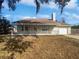 House exterior with a front porch and a detached garage at 4000 Barbary Ln, North Port, FL 34287