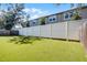 Artificial turf backyard with tall privacy fence at 13910 Fullerton Dr, Tampa, FL 33625