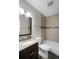 Clean bathroom with granite countertop, bathtub, and updated tile at 13910 Fullerton Dr, Tampa, FL 33625