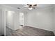 Light and airy bedroom with hardwood floors and a ceiling fan at 13910 Fullerton Dr, Tampa, FL 33625