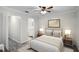 Cozy bedroom with ceiling fan, ensuite bathroom and hardwood floors at 13910 Fullerton Dr, Tampa, FL 33625