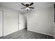 Spacious bedroom with ceiling fan and gray tile flooring at 13910 Fullerton Dr, Tampa, FL 33625