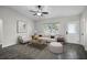 Living room with hardwood floors, neutral walls, and a comfy sofa at 13910 Fullerton Dr, Tampa, FL 33625