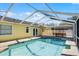 Relaxing pool area with patio and screen enclosure at 13910 Fullerton Dr, Tampa, FL 33625