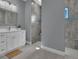 Modern bathroom with walk-in shower and white vanity at 143 Long Meadow Ln, Rotonda West, FL 33947