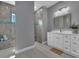 Modern bathroom with walk-in shower and white vanity at 143 Long Meadow Ln, Rotonda West, FL 33947