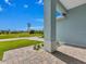 Inviting front porch with a view of the neighborhood at 143 Long Meadow Ln, Rotonda West, FL 33947