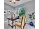 Bright home office features a large window and wood desk at 143 Long Meadow Ln, Rotonda West, FL 33947