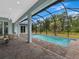 Spacious pool and patio area with screened enclosure at 143 Long Meadow Ln, Rotonda West, FL 33947