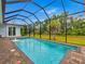 Inviting screened-in pool with a water feature at 143 Long Meadow Ln, Rotonda West, FL 33947