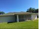 House with screened patio and grassy backyard at 4666 Laramie Cir, North Port, FL 34286