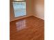 Bedroom with laminate wood flooring and window at 4666 Laramie Cir, North Port, FL 34286