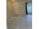 Home entryway with tile floor and neutral colors at 4666 Laramie Cir, North Port, FL 34286