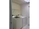 Laundry room with washer, dryer, and shelving at 4666 Laramie Cir, North Port, FL 34286