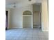 Bright living room with tile floors and built-in shelving at 4666 Laramie Cir, North Port, FL 34286