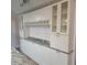 White shaker cabinets and granite countertops in this kitchen at 6505 Oelsner St, New Port Richey, FL 34652