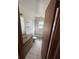Simple bathroom with shower/tub combo and wood vanity at 7027 Hawkins Rd, Sarasota, FL 34241