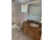 Bathroom with shower/tub combo and wood vanity at 7027 Hawkins Rd, Sarasota, FL 34241