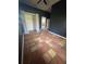 Simple bedroom featuring tile flooring and a closet at 7027 Hawkins Rd, Sarasota, FL 34241