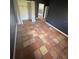Bright bedroom with tile floors and a large closet at 7027 Hawkins Rd, Sarasota, FL 34241