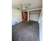 Bedroom with carpet, ceiling fan, and closet at 7027 Hawkins Rd, Sarasota, FL 34241
