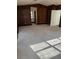 Primary bedroom with wood paneling and carpet at 7027 Hawkins Rd, Sarasota, FL 34241