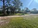 House with a large yard and driveway at 7027 Hawkins Rd, Sarasota, FL 34241