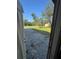 Gravel driveway and yard with mature trees at 7027 Hawkins Rd, Sarasota, FL 34241