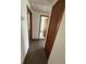 Clean hallway with carpet, leading to bedrooms and bathroom at 7027 Hawkins Rd, Sarasota, FL 34241